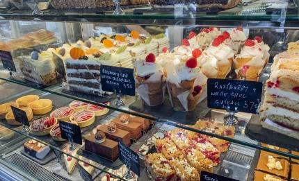 cake shop window full of cakes