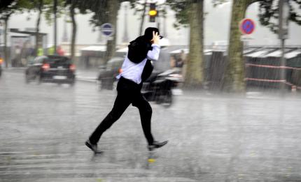 Man walking in downpour