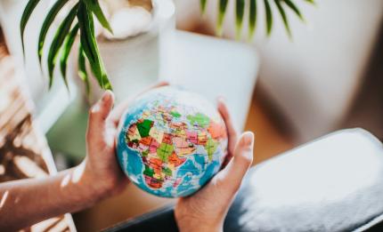 hands holding a globe