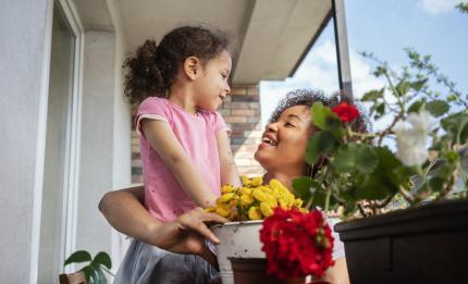 Mum and child holding flowers