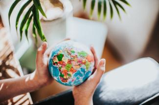 hands holding a globe