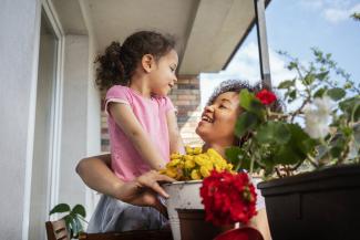 Mum and child holding flowers